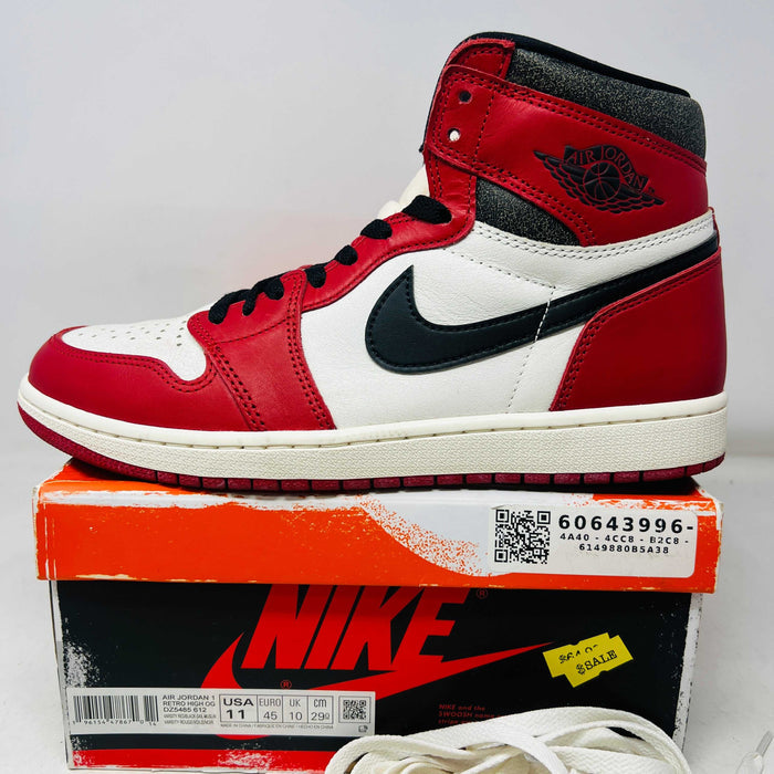 Jordan 1 Retro High OG Chicago Lost and Found sneaker with red, white, and black colorway on original Nike box with extra white laces