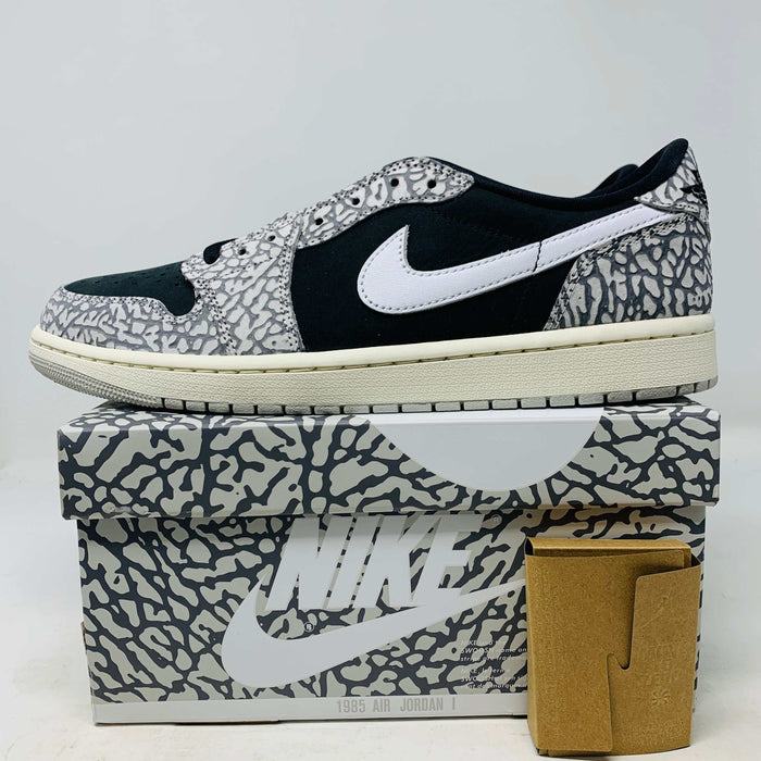 Jordan 1 Retro Low OG Black Cement sneaker on matching box with extra laces 2024 edition