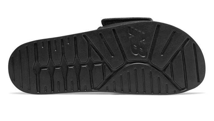 New Balance 200 Adjustable sandals outsole in black with textured grooves for traction, sole/bottom view.