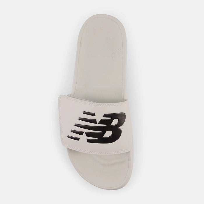 New Balance 200v2 Adjustable slide sandal in white with black oversized NB logo, top view showing cushioned footbed.