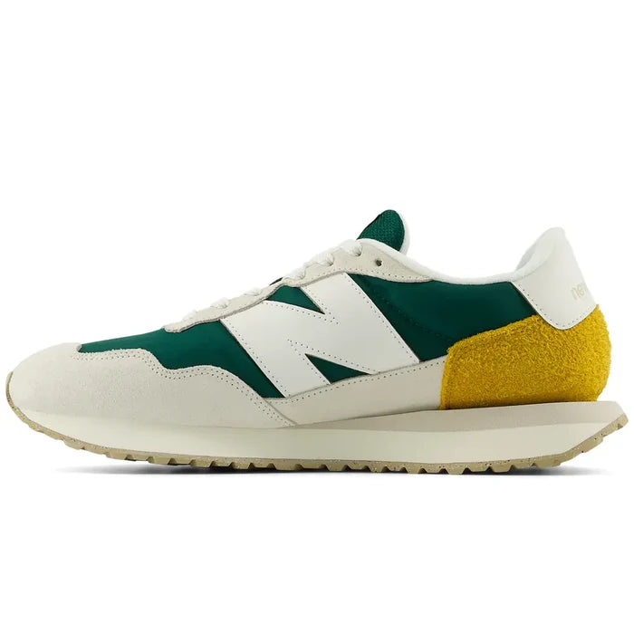 New Balance 237 V1 sneakers in green, cream, and yellow featuring suede overlays, retro design, and side view.