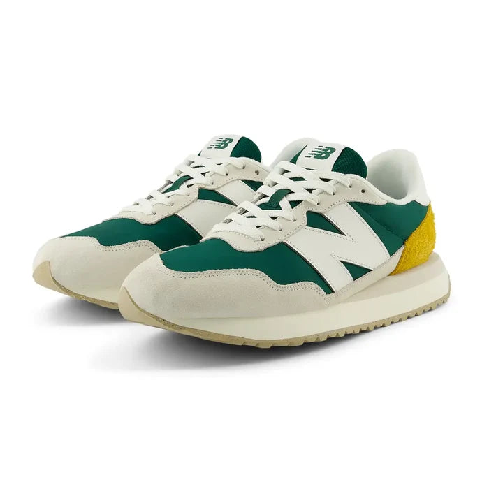 New Balance 237 V1 sneakers in green, white, and yellow with suede overlays and retro-inspired design, angled front view.