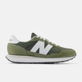 New Balance 237 sneakers in olive green with white accents, suede overlays, and ripstop upper, side view.