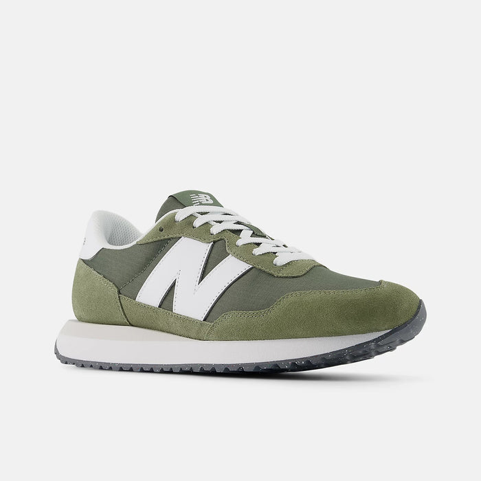 New Balance 237 sneakers in olive green with suede and nylon upper, white "N" logo, lace-up closure, and textured outsole, side angle.