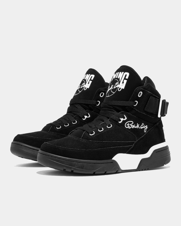Ewing Athletics 33 HI OG sneakers in black suede with a high-top design, white logo detailing, and adjustable ankle strap, angled front view.