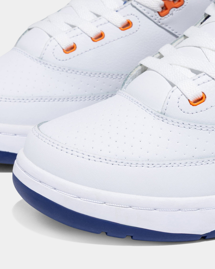Ewing Athletics 33 HI OG sneakers in white leather with orange eyelets and perforated detailing, close-up side view.