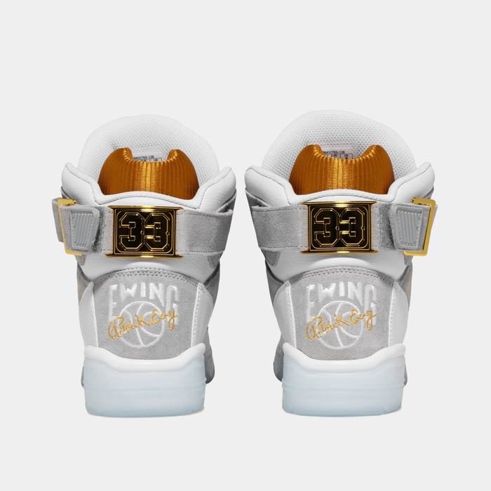 Ewing Athletics 33 HI x LAURENS J sneakers in white and gray with gold accents, back view showing embroidered branding and gold "33" details.