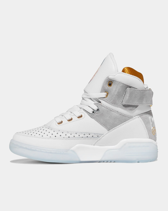 Ewing Athletics 33 HI x LAURENS J sneakers, white leather upper with gray suede accents, perforated toe box, gold details, and translucent outsole, side view.