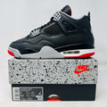Jordan 4 Retro Bred sneaker on Nike Air box with black, red, and grey design