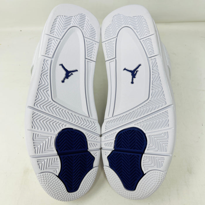 The Jordan 4 Retro Metallic Purple sneaker features white material with blue mesh accents, a visible air cushion in the heel, textured sole, angular overlays, and a padded collar. Note: no box included.