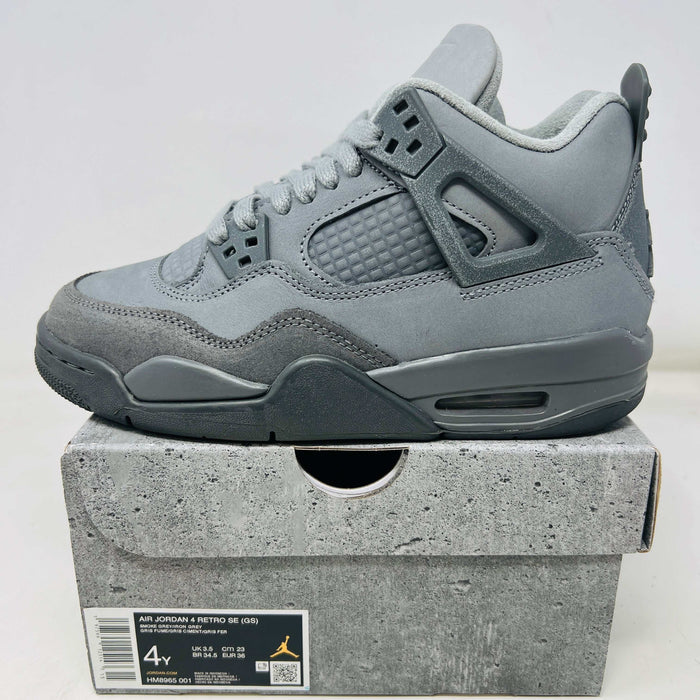 Jordan 4 Retro SE Paris Olympics Wet Cement GS sneaker in grey on box, 2024 edition