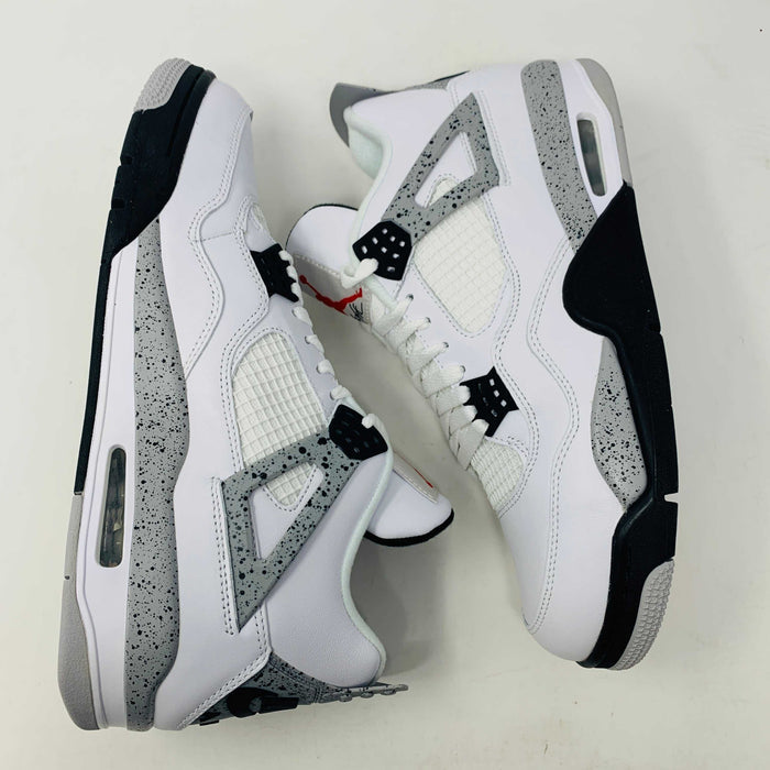 Check out the Jordan 4 White Cement 2016, a white sneaker with black and gray speckles. It features a small red jumping logo, comes in a matching box, and includes the classic 2016 Jordan hang tag for authenticity.