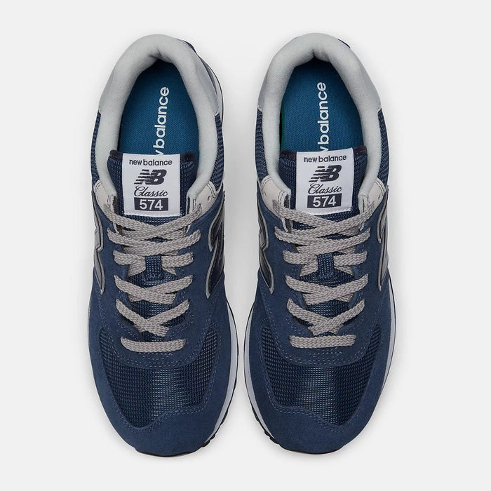 New Balance 574 Core shoes top view showing navy blue suede and mesh upper with gray laces and tongue branding.