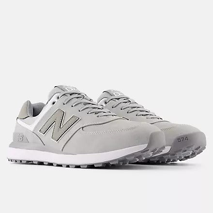 New Balance Golf 574 Greens v2 golf shoes in light gray with leather upper, white midsole, and grip outsole, front angle view.