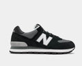 New Balance 574 Rugged shoes in black and gray with suede overlays, mesh panels, ENCAP midsole, and rugged outsole, side view.