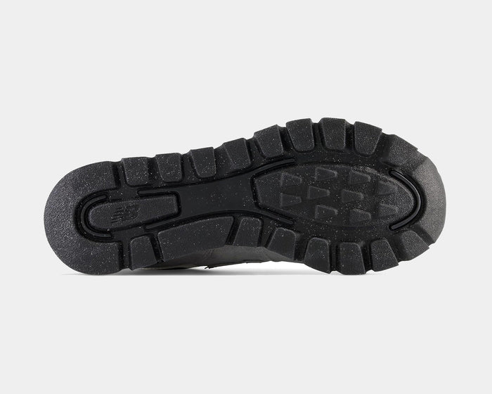 New Balance 574 Rugged shoes outsole with durable black rubber and deep traction grooves, bottom view.