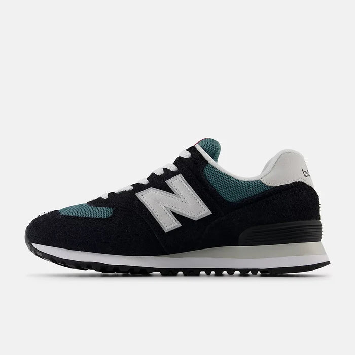 New Balance 574 sneakers featuring a black suede and teal mesh upper with white accents and "N" logo, side view.