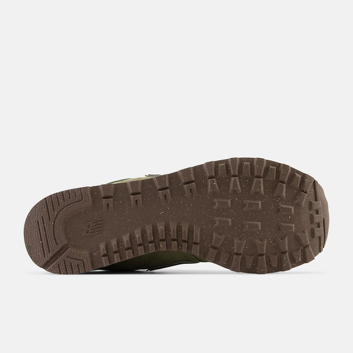New Balance 574 sneakers outsole in brown rubber with lugged tread pattern for traction, bottom view.