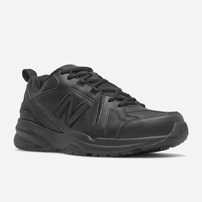 New Balance 608v5 Slip Resistant shoes in black leather with slip-resistant outsole and cushioned midsole, side angle view.