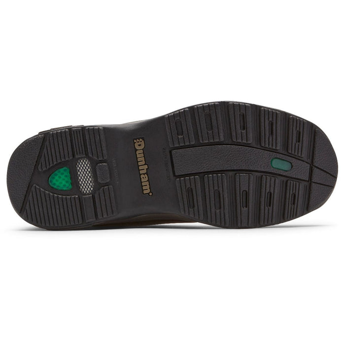 Dunham 8000 Mid Waterproof Boot outsole in black rubber with textured tread pattern and branding, sole/bottom view.
