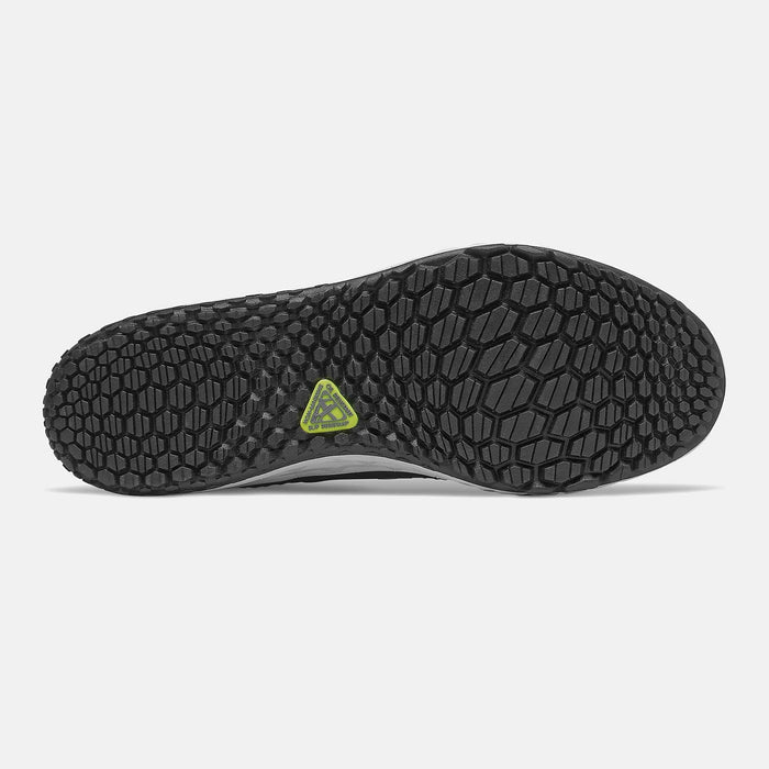 New Balance 806v1 outsole with textured hexagonal pattern and durable black rubber, sole/bottom view showing lime green logo detail.