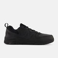 New Balance 857v3 Slip Resistant shoes in all-black with leather upper, slip-resistant outsole, and padded collar, side view.