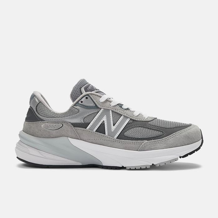 New Balance 990v6 running shoes in gray with suede and mesh upper, white midsole, and "N" logo, side view.