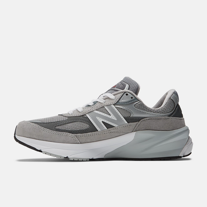 New Balance 990v6 running shoes in gray with mesh upper, suede overlays, and cushioned midsole, side view.