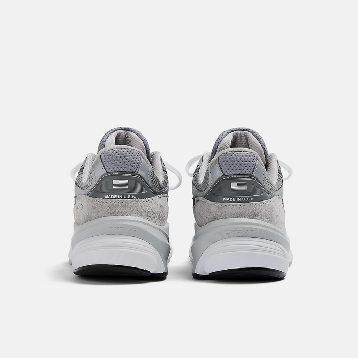 New Balance 990v6 running shoes back view showing gray suede overlay, mesh details, and "Made in U.S.A." branding.
