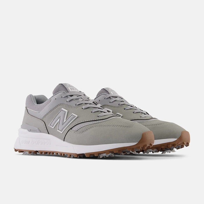 New Balance Golf 997 Golf shoes in gray with a suede upper, white midsole, and gum outsole with spikeless traction, side angle.
