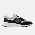 New Balance 997H sneakers in black, cream, and green with suede overlays, mesh upper, and white midsole, side view.