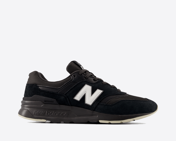 New Balance 997H sneakers in black with suede and mesh upper, white "N" logo, and neutral-tone midsole, side view.