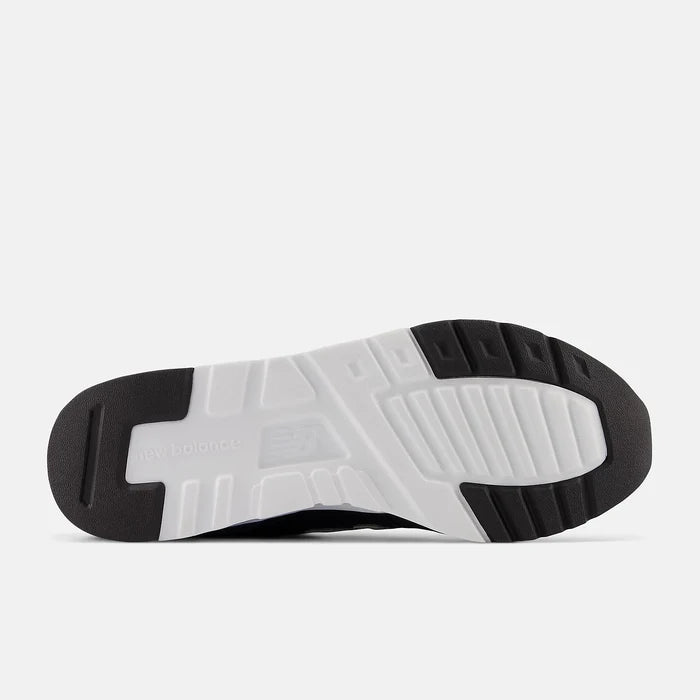 New Balance 997H sneakers outsole in black and white rubber with textured tread and branding, sole/bottom view.