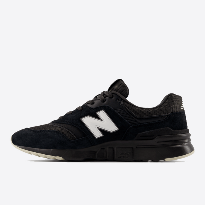 New Balance 997H sneakers in black suede and mesh with white logo and gray accents, side view showing midsole design.