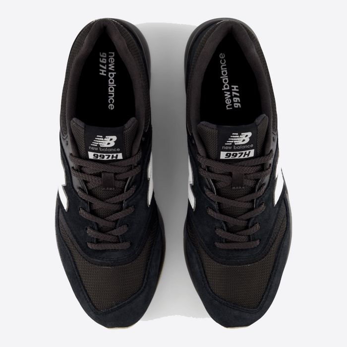 New Balance 997H sneakers in black with mesh upper, suede overlays, and white branding, top view.