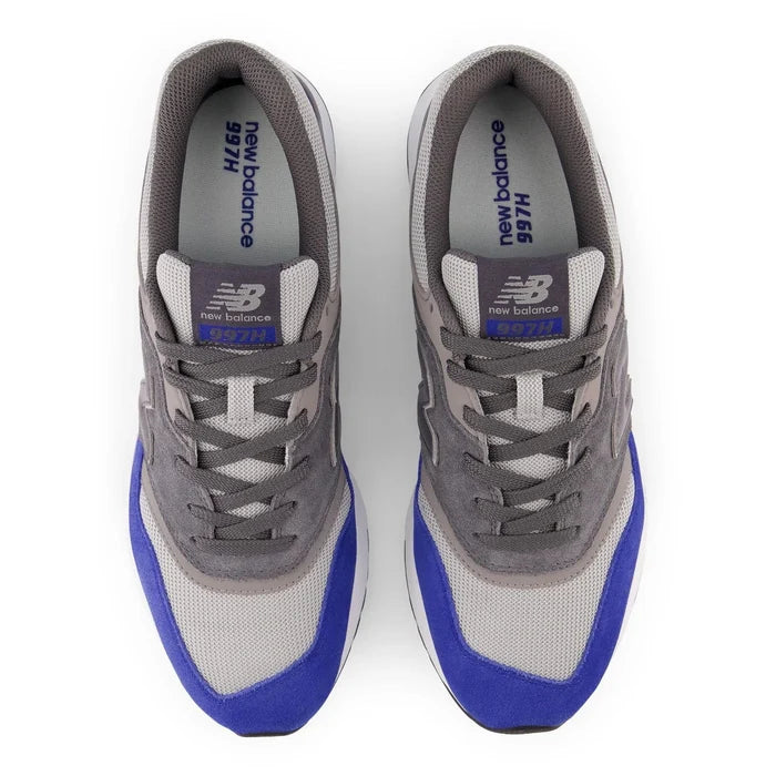 New Balance 997H sneakers top view in gray with blue suede overlays, mesh upper, and lace-up design.