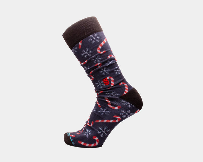 Tall Order Candy Cane Extra Cushioned socks, navy with red and white candy cane and snowflake patterns, side view.