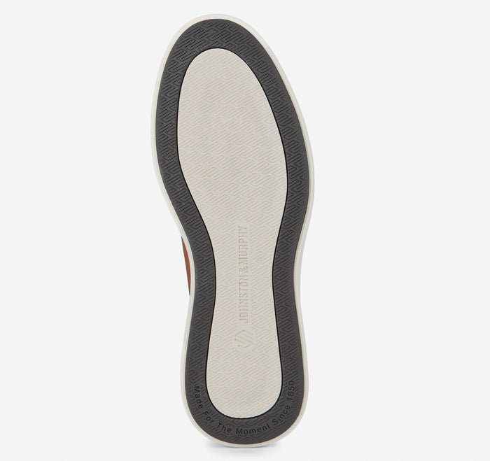 Johnston & Murphy Ackerson Perfed Plain Toe shoe outsole showing textured tread design with brand logo and contrast rubber in gray and white.
