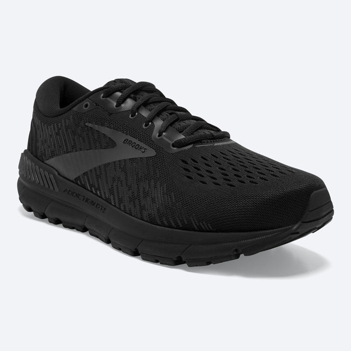 Brooks Addiction GTS 15 running shoes in black with a mesh upper, GuideRails support system, and cushioned sole, side/front angle.