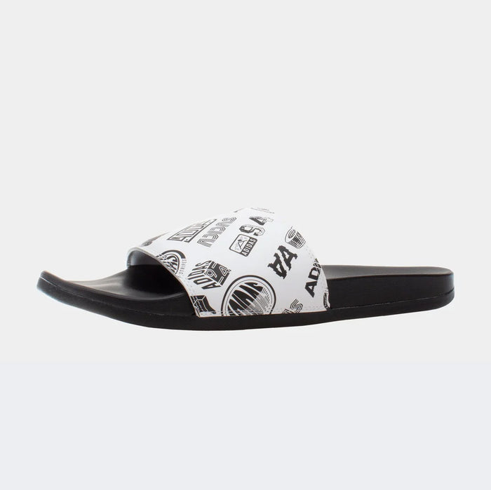 Adidas Adilette Comfort Slides with white printed strap and black footbed, side view.
