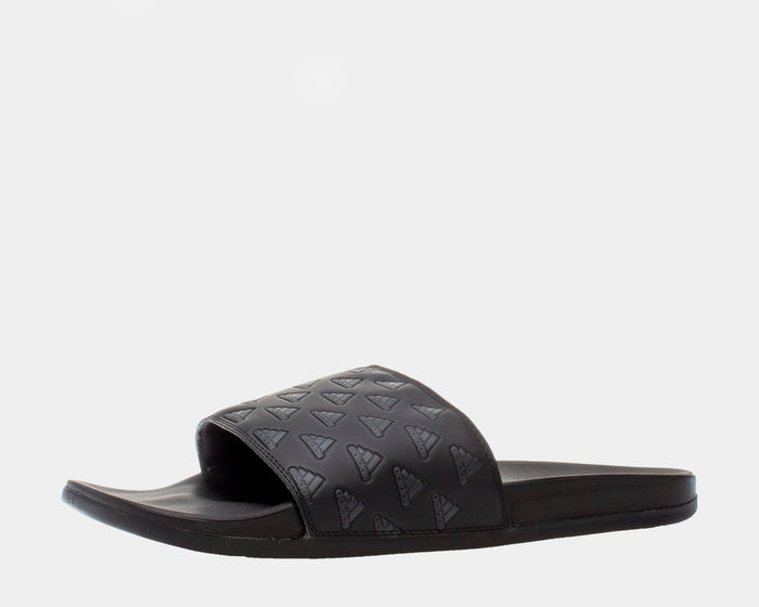 Adidas Adilette Comfort slides in black with embossed Adidas logo design on strap and cushioned footbed, side view.