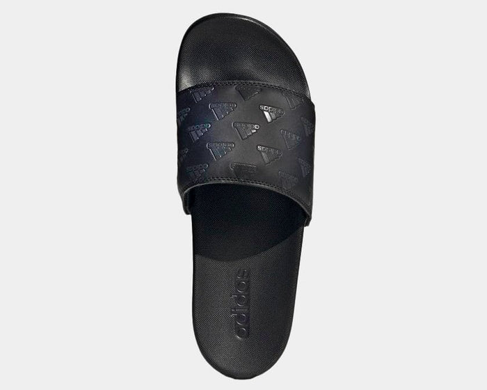 Adidas Adilette Comfort sandals in black featuring embossed Adidas branding on the strap, top view showing cushioned footbed