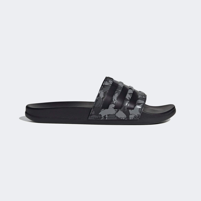 Adidas Adilette Comfort slides in black and gray with camouflage strap design and contoured footbed, side view.