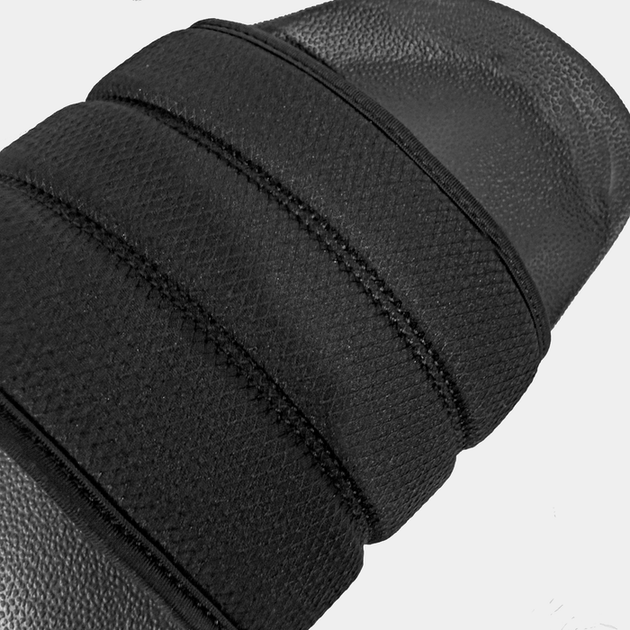 Adidas Adilette NoShower Slides in black with textured synthetic upper and cushioned footbed, top view close-up.