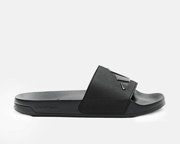 Adidas Adilette Shower Slides in black with textured strap and Cloudfoam footbed, side view.