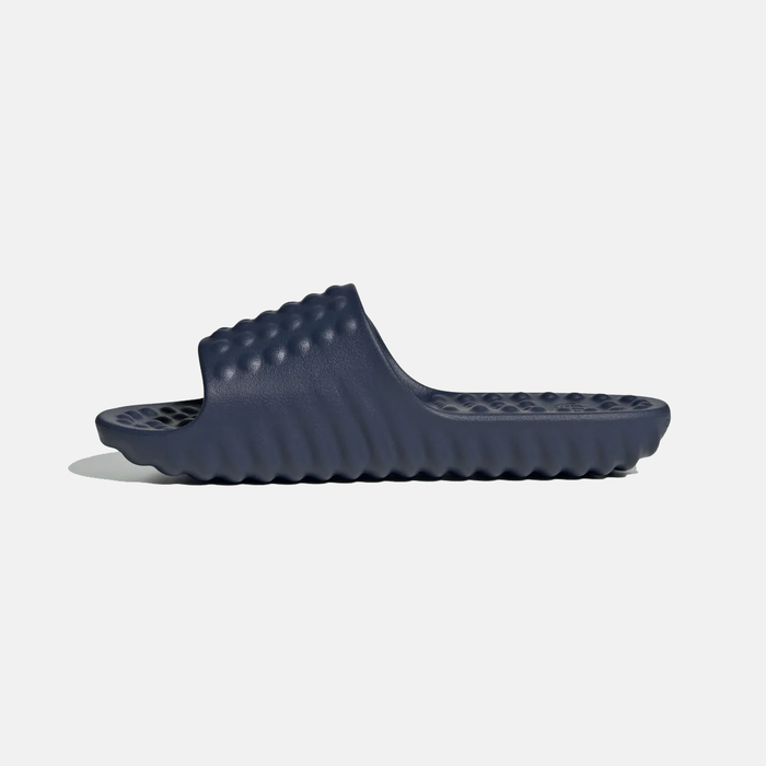 Adidas Adissage 360REC slides in solid navy blue featuring textured massage footbed and ripple-pattern outsole, side view.
