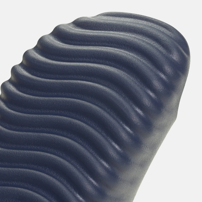 Adidas Adissage 360REC Slides in navy blue showing textured footbed design for comfort and grip.