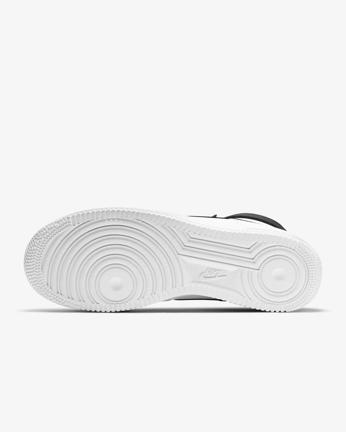Nike Air Force 1 07 High sneakers outsole in white rubber with signature circular traction pattern, bottom view.