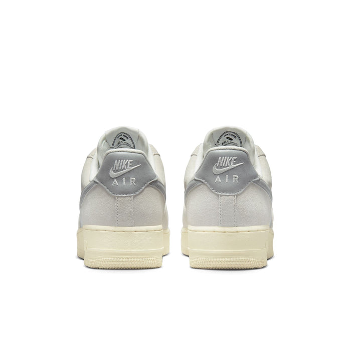 Nike Air Force 1 '07 LV8 sneakers back view, featuring gray suede heel panels with Nike Air branding and cream sole.