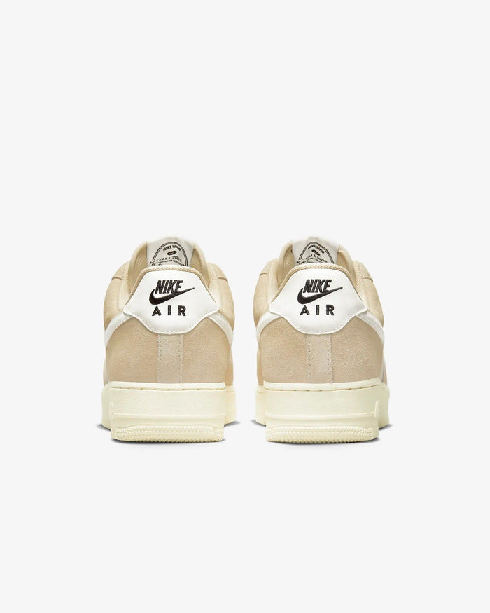 Nike Air Force 1 '07 LV8 sneakers in beige suede and white leather with embroidered Nike Air logo, back view.